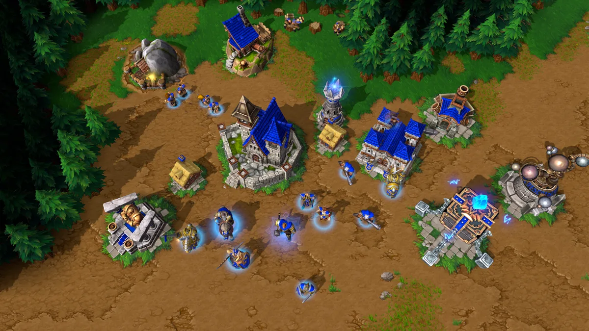 Base Human di mode grafis Definitive Edition Warcraft III: Town Hall, Farm, Barracks, dan unit Footman di atas tanah coklat dan pohon